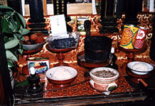 Tea with family Buddhist altar