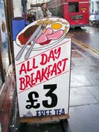 A typical street scene. See the "Free Tea" at the bottom of the sign?